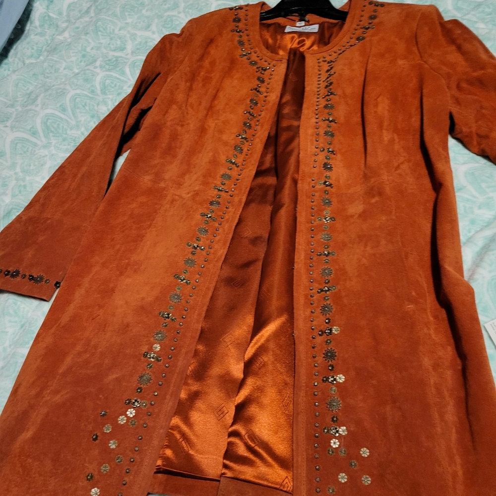 Long leather beaded coat. Burt orangey or salmon color.